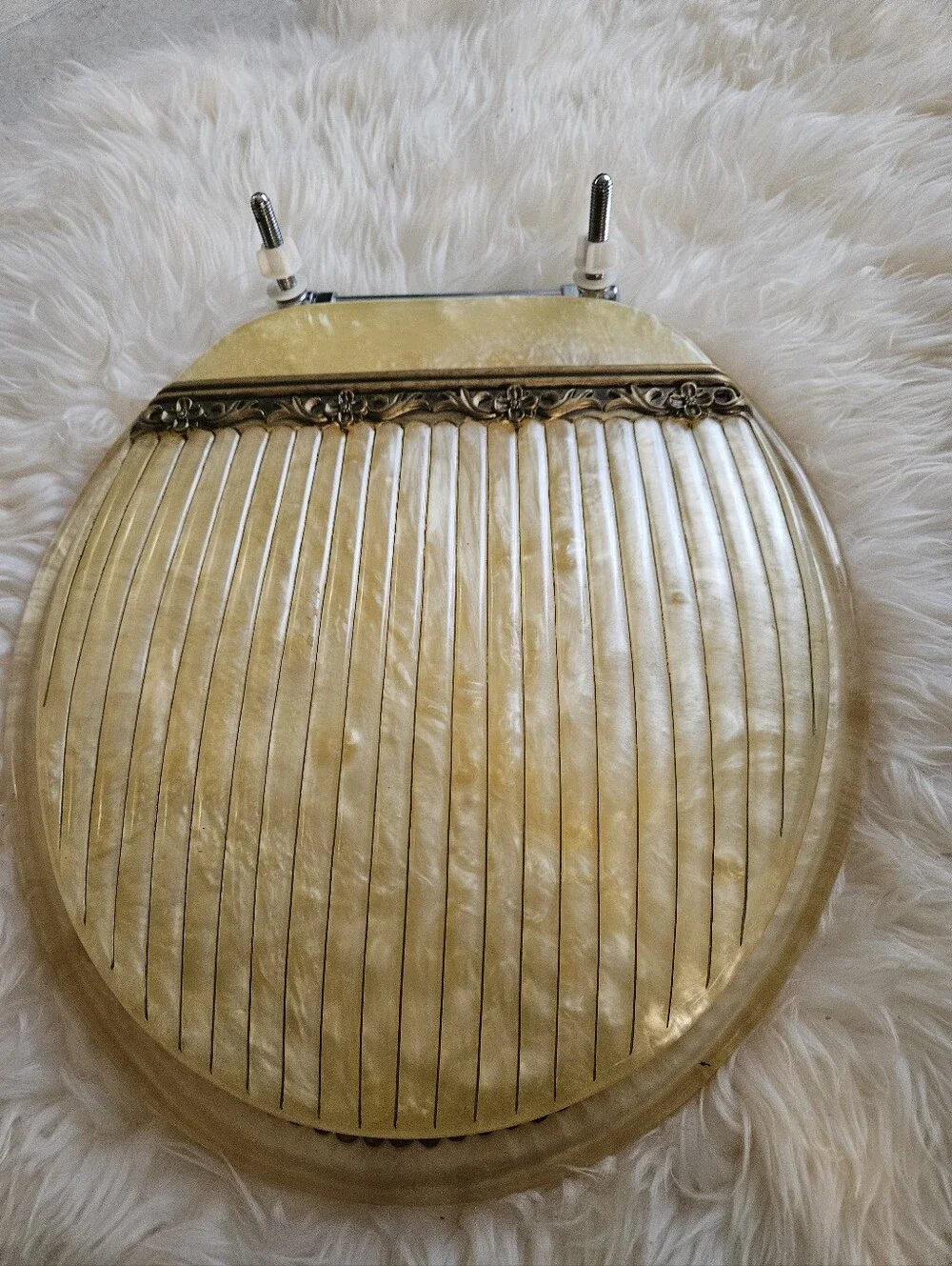Vintage-Inspired Cream Toilet Seat Round with Decorative Hinge Accent Elegant.
